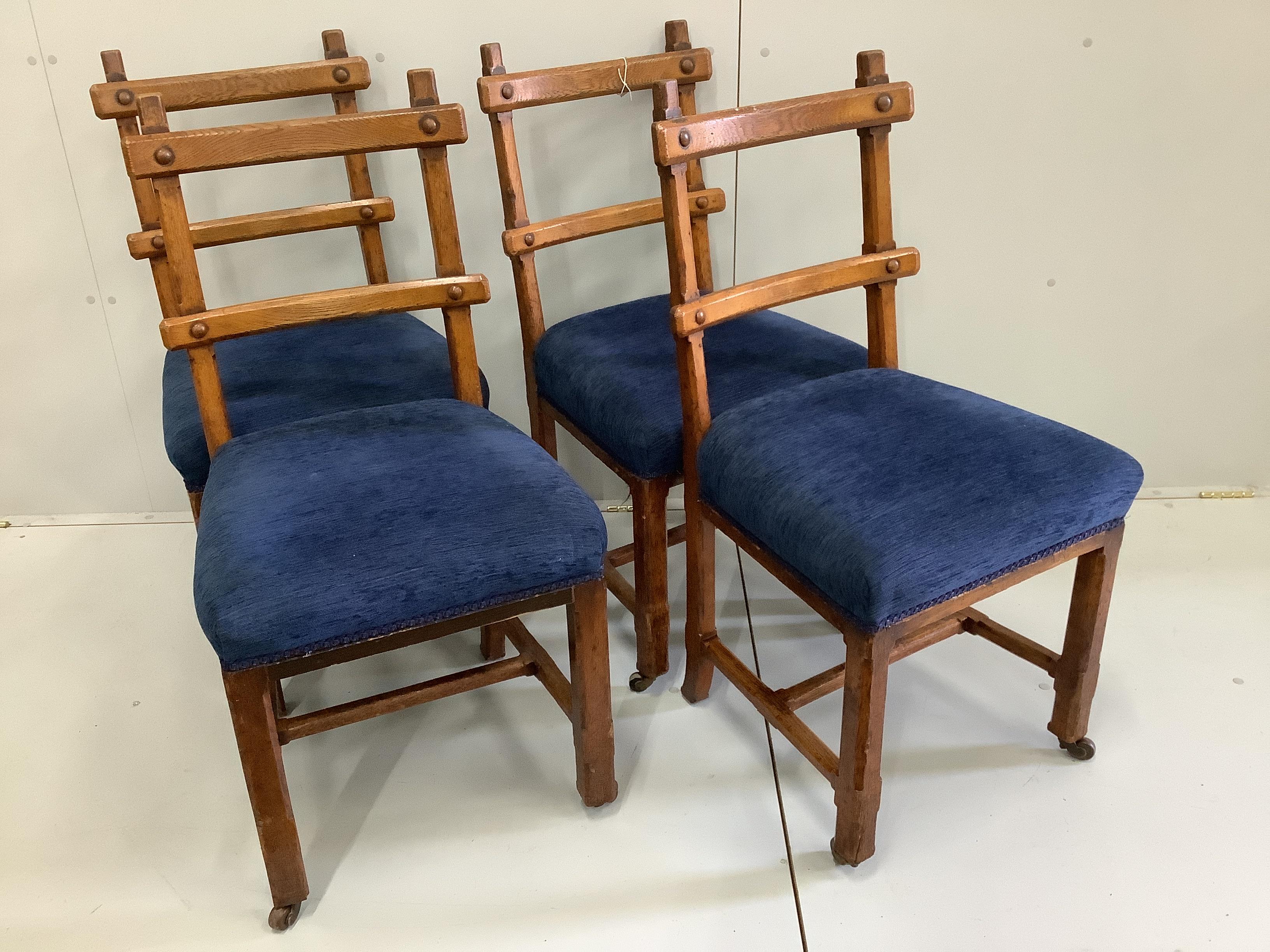 A set of four Victorian Pugin style oak dining chairs